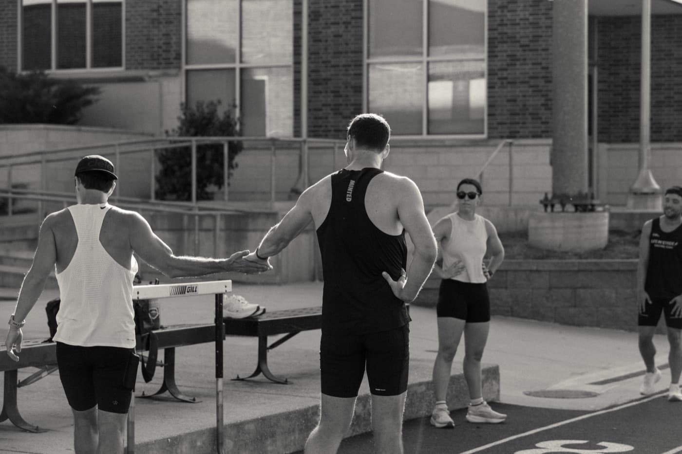 Teammates congratulating each other after a track workout